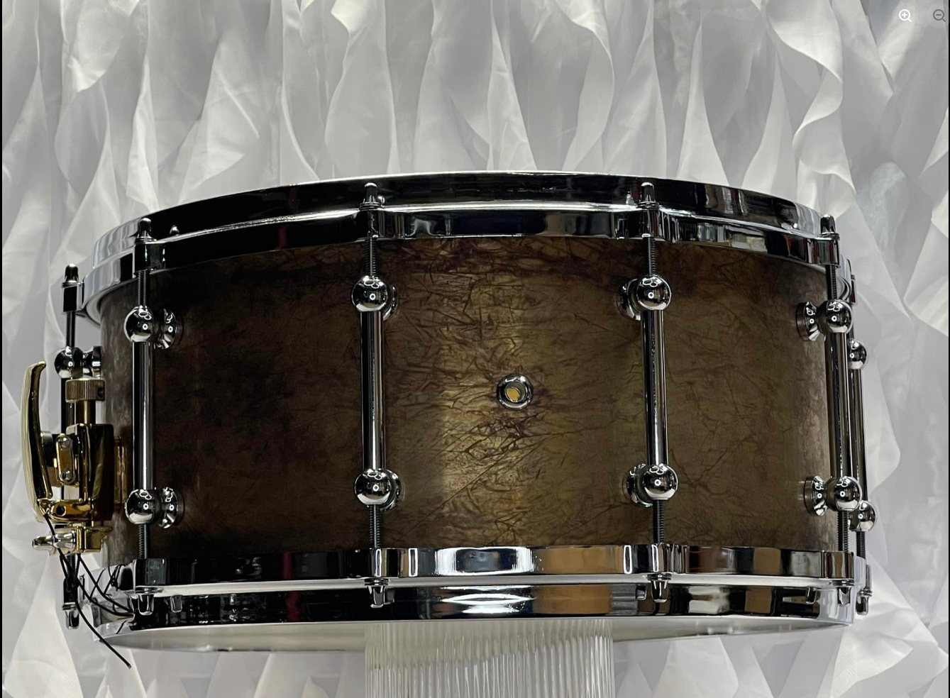 Custom 2mm brass 14x6 snare drum with patina finish and aluminum die-cast rims